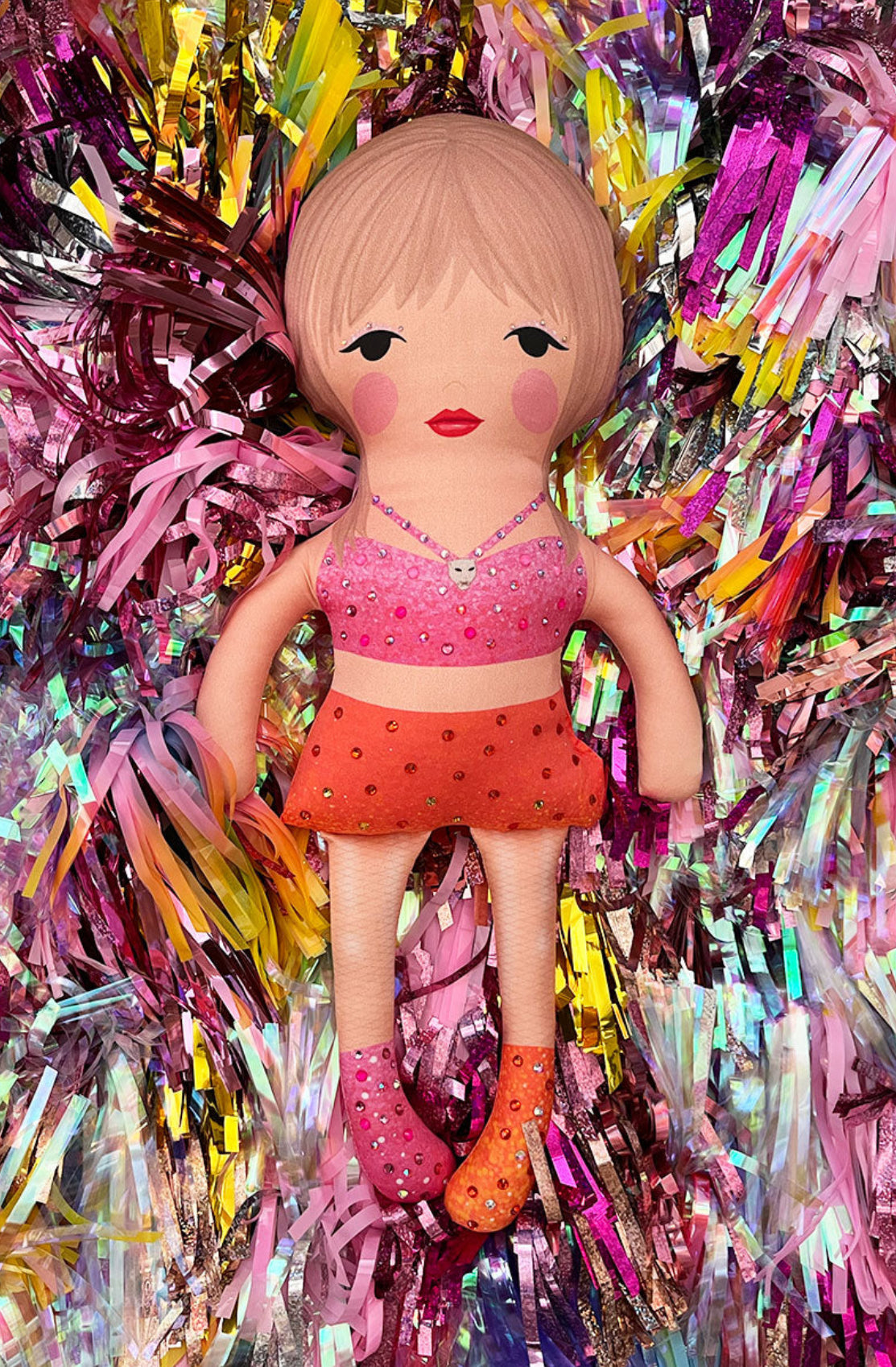 the unstuffed 1989 doll in pink and orange