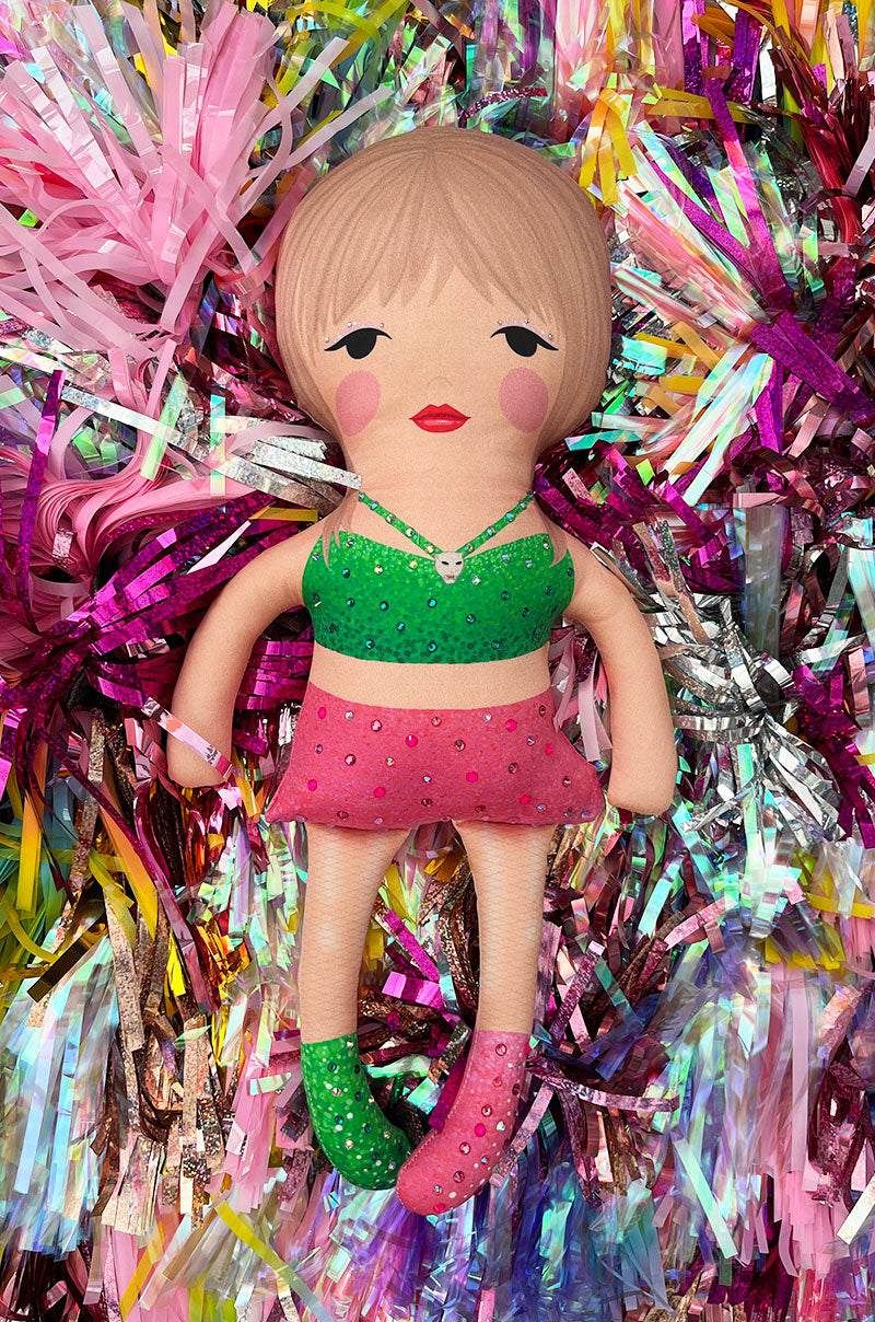 the 1989 doll in pink and green