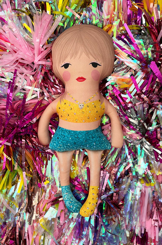 the 1989 doll in yellow and blue