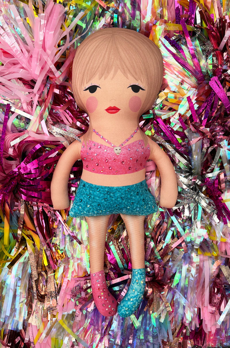 the 1989 doll in pink and blue