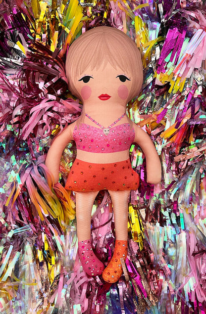 the unstuffed 1989 doll in pink and orange