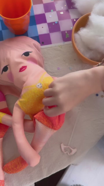 the unstuffed 1989 doll in pink and blue